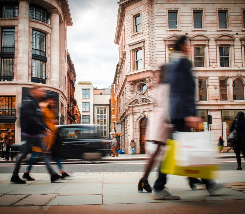 Motion blurred high street shoppers