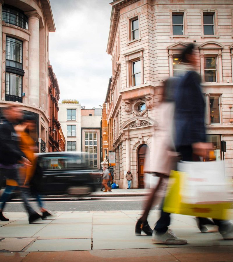 Motion blurred high street shoppers